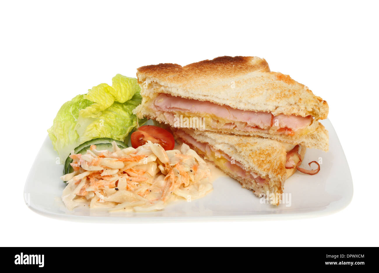 Toasted cheese and ham sandwich with salad on a plate isolated against white Stock Photo