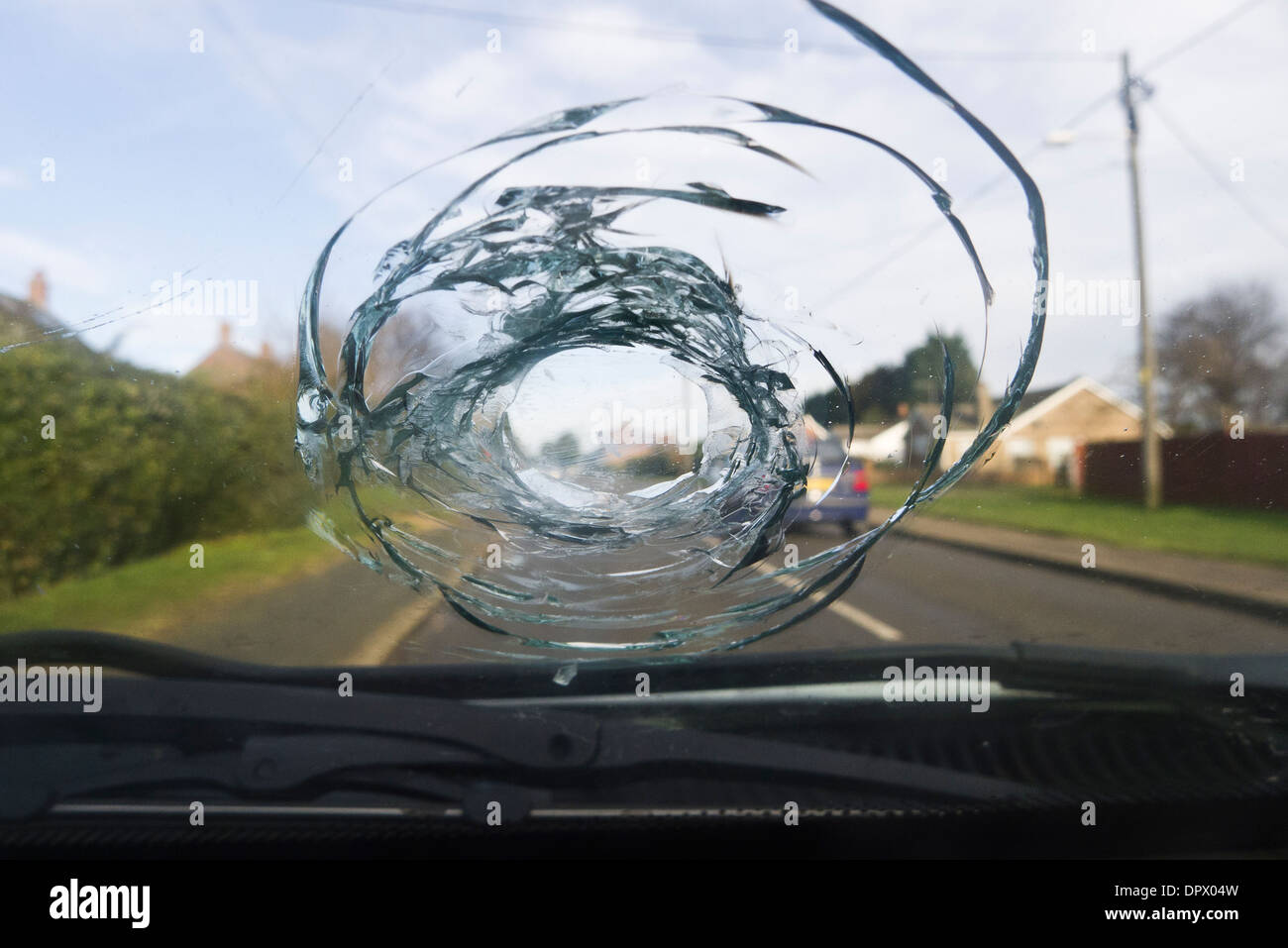 Vehicle windscreen damaged by a stone. Stock Photo