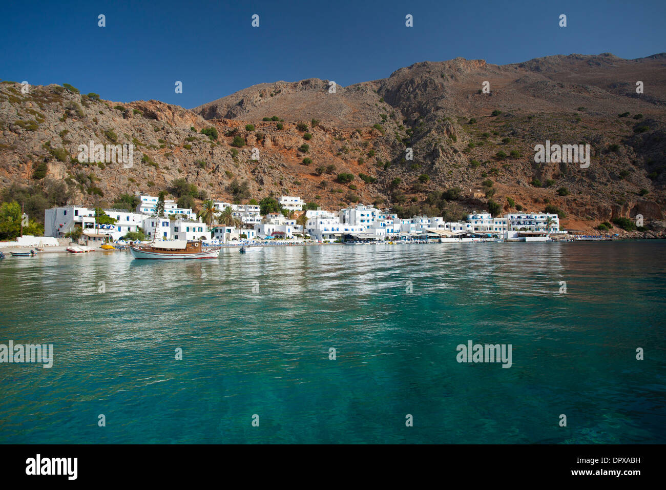 The village of Loutro beneath the White Mountains, Sfakia, Chania District, Crete, Greece. Stock Photo