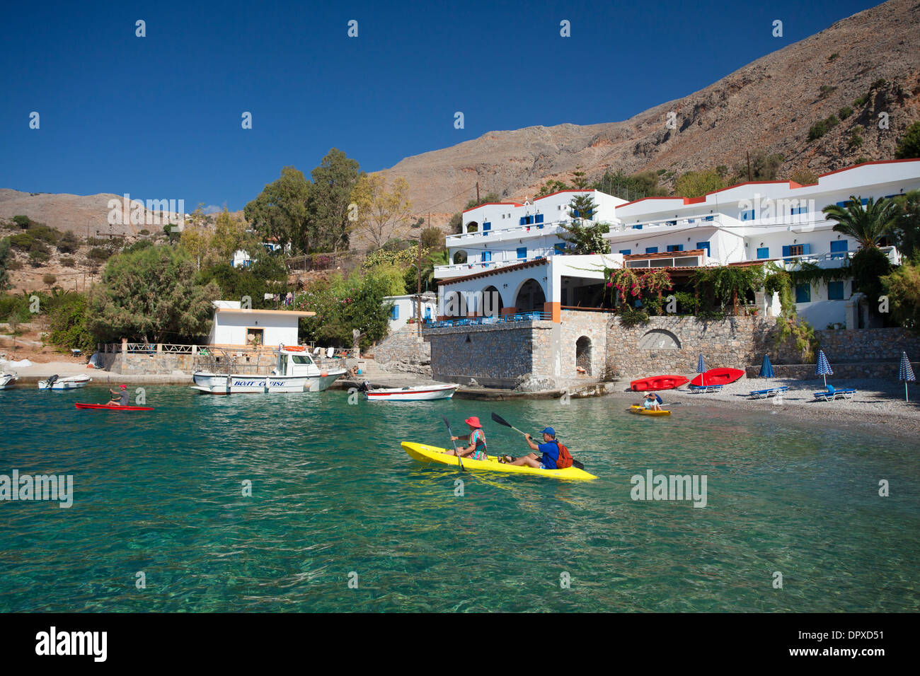 Sea kayaking near the hamlet of Finix or Phoenix, Loutro, Sfakia, Chania District, Crete, Greece. Stock Photo