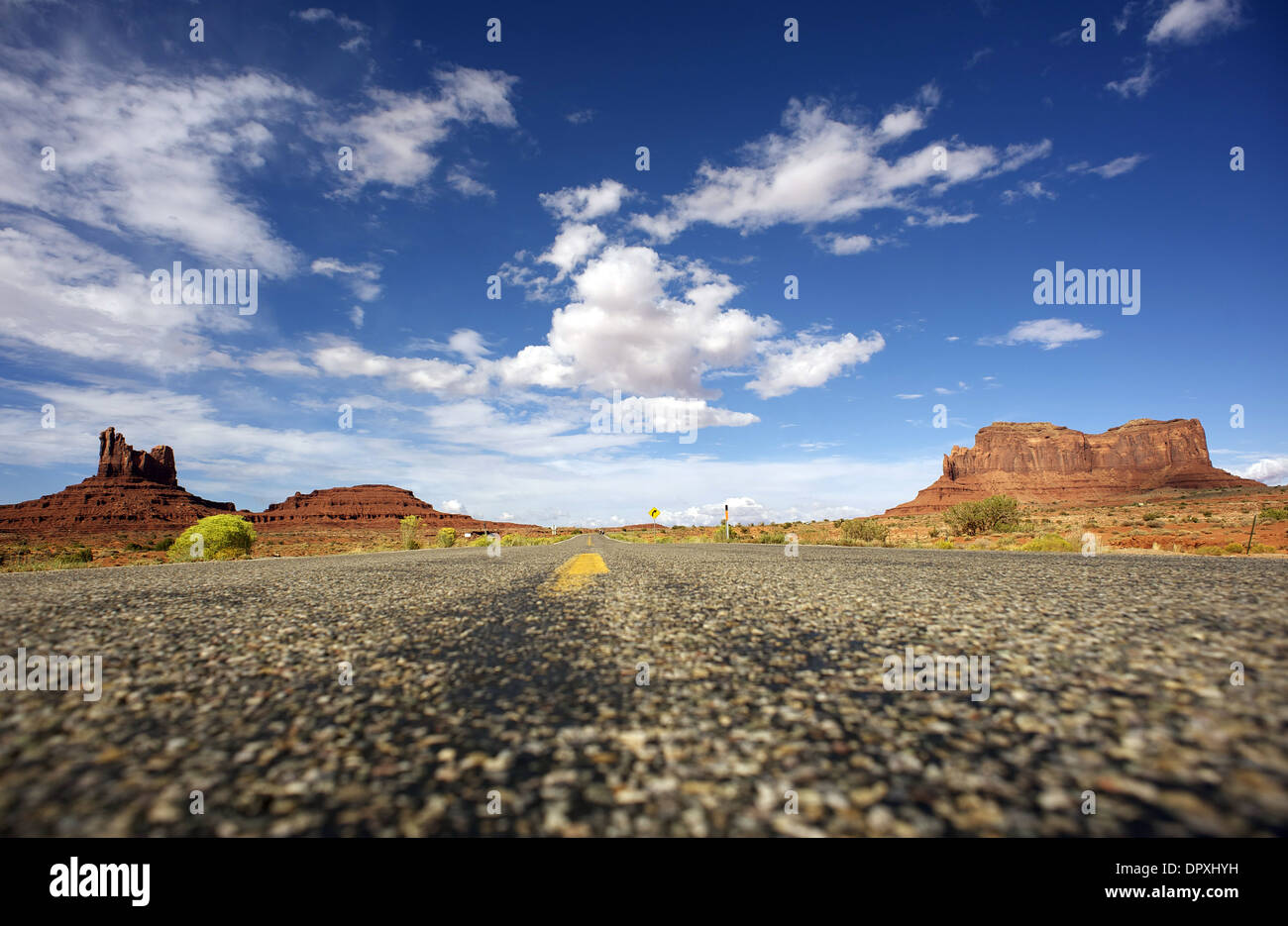 Direction Arizona. Hot Summer Arizona Highway with Monument Valley Rock