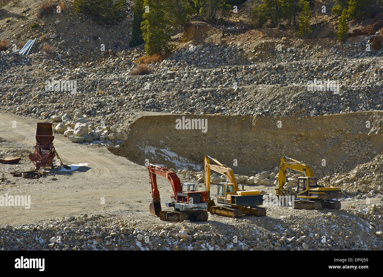 Small Gold Mine Operation. Excavators and Small Sluice Box. Stock Photo