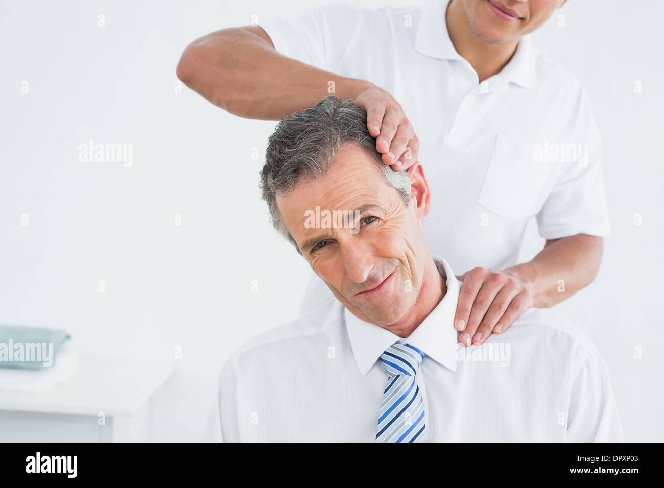 Chiropractor adjust patient hi-res stock photography and images - Alamy