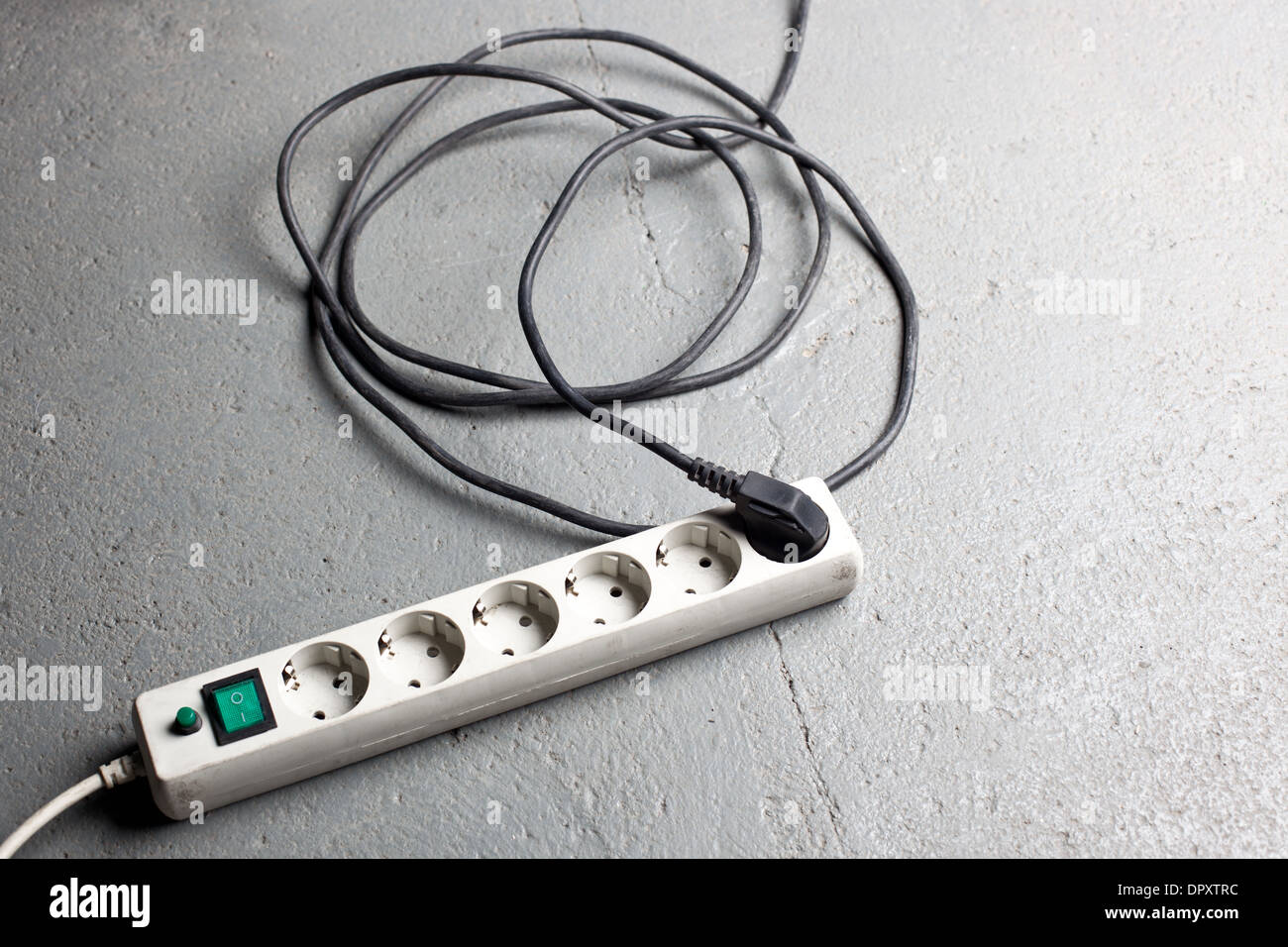 Extension cord on concrete floor Stock Photo Alamy