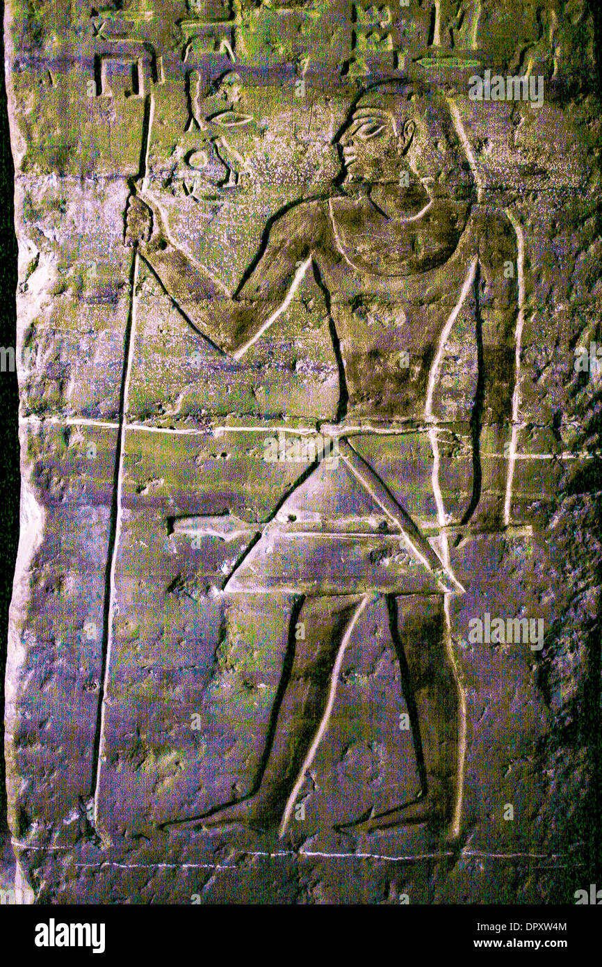 Ancient hieroglyphics on wall near Aswan, Egypt. Stock Photo