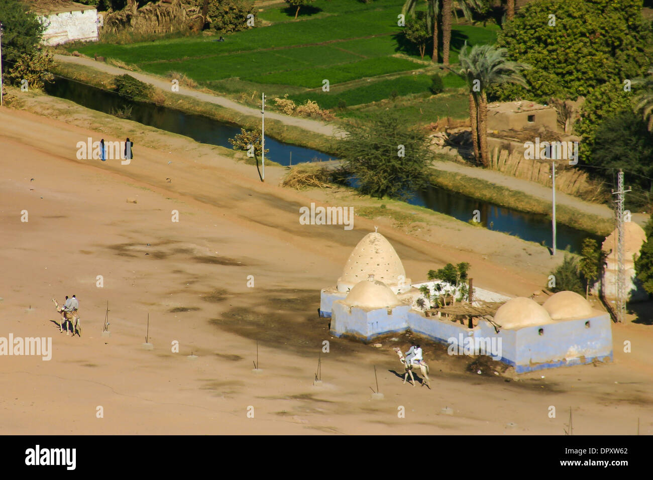 Camel riding on west bank of Nile River near Aswan, Egypt. Stock Photo