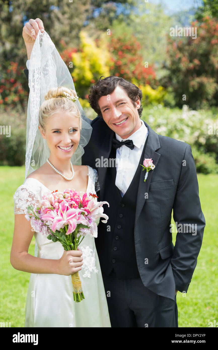 Woman holding her veil hi-res stock photography and images - Alamy
