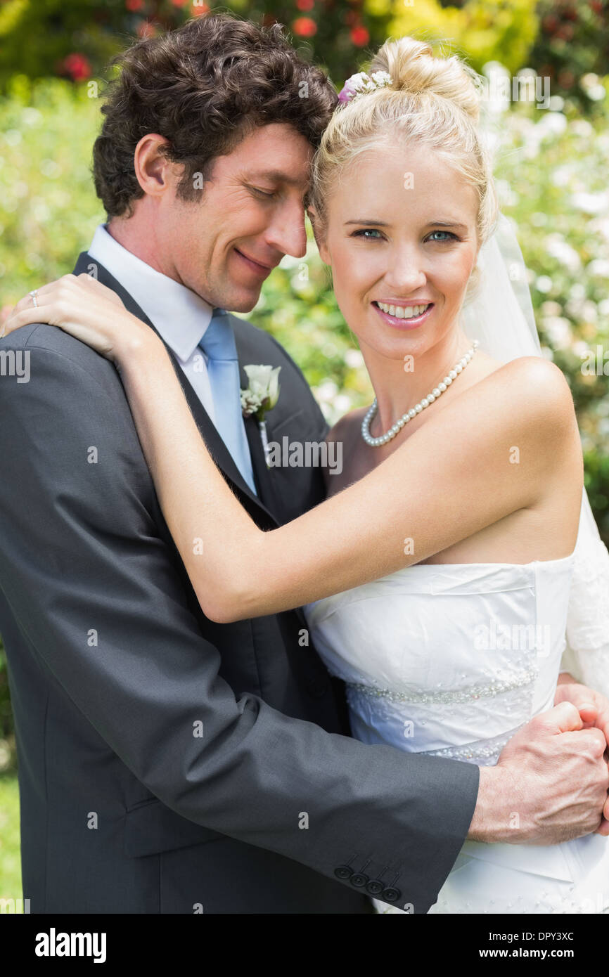 Romantic attractive newlywed couple hugging each other Stock Photo - Alamy