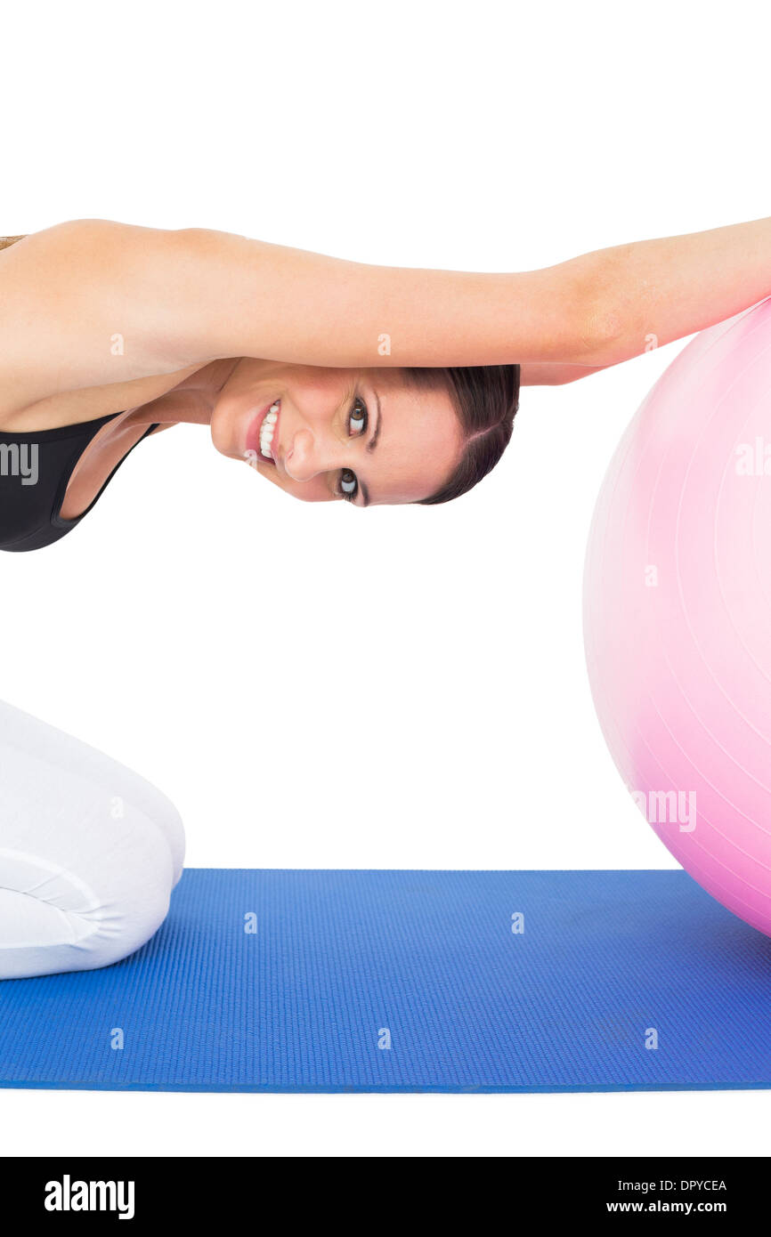 Side view portrait of a fit young exercising with fitness ball Stock ...