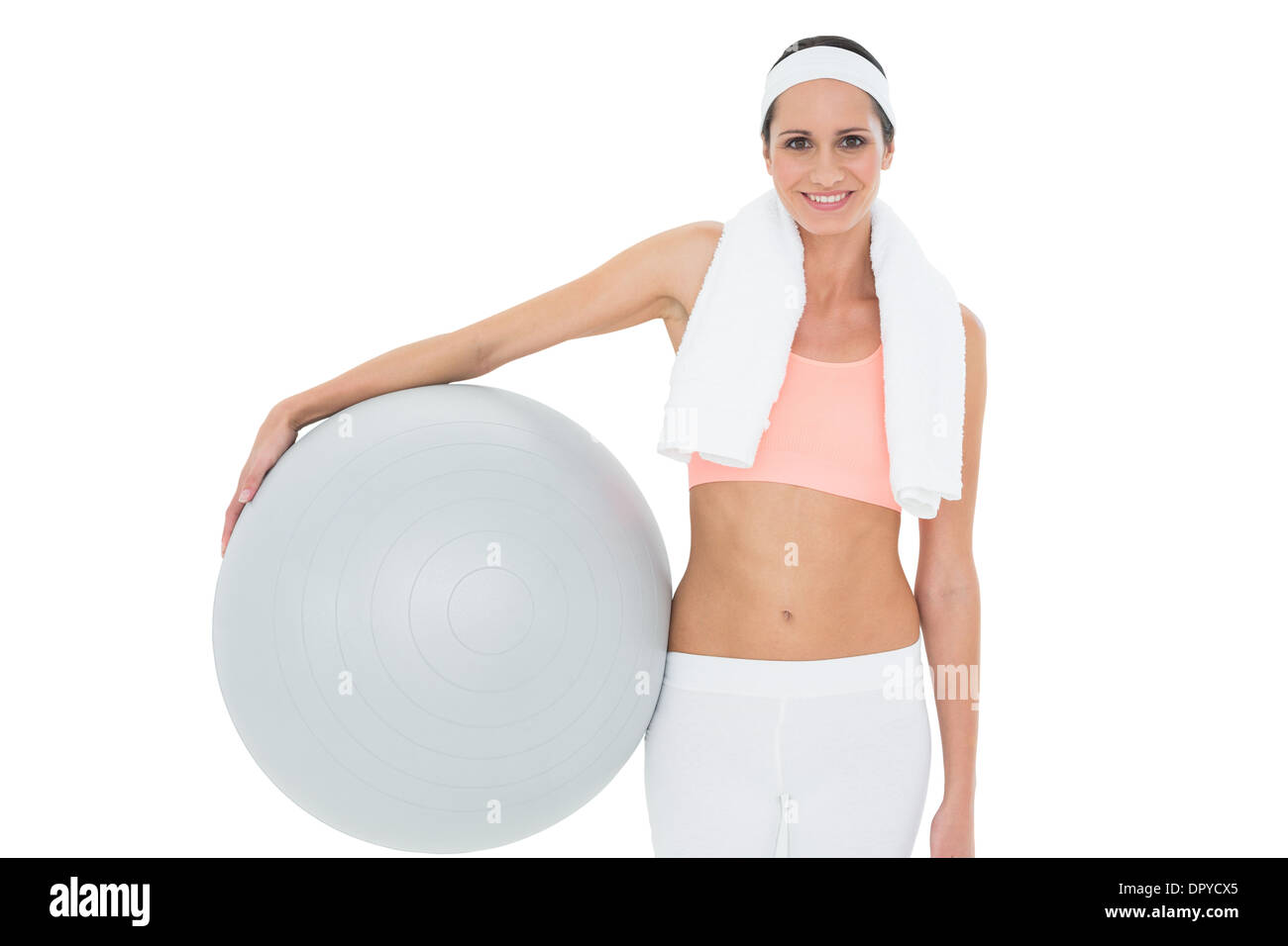 Portrait of a smiling fit woman holding fitness ball Stock Photo