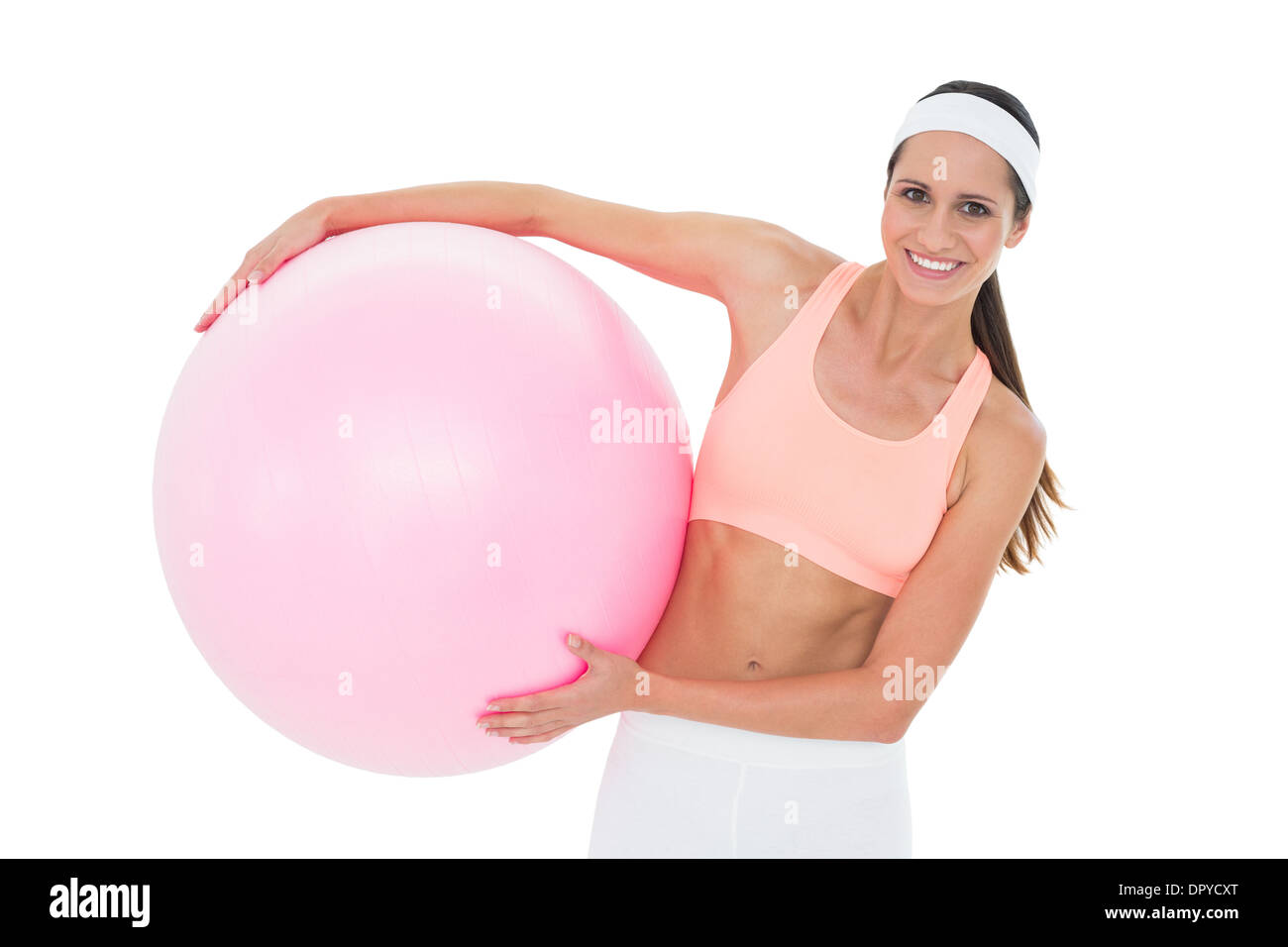 Portrait of a smiling fit woman holding fitness ball Stock Photo