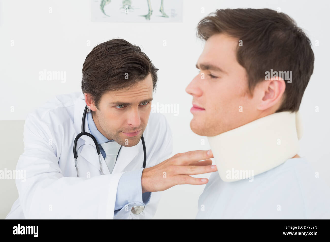 Doctor examining a patients sprained neck Stock Photo Alamy