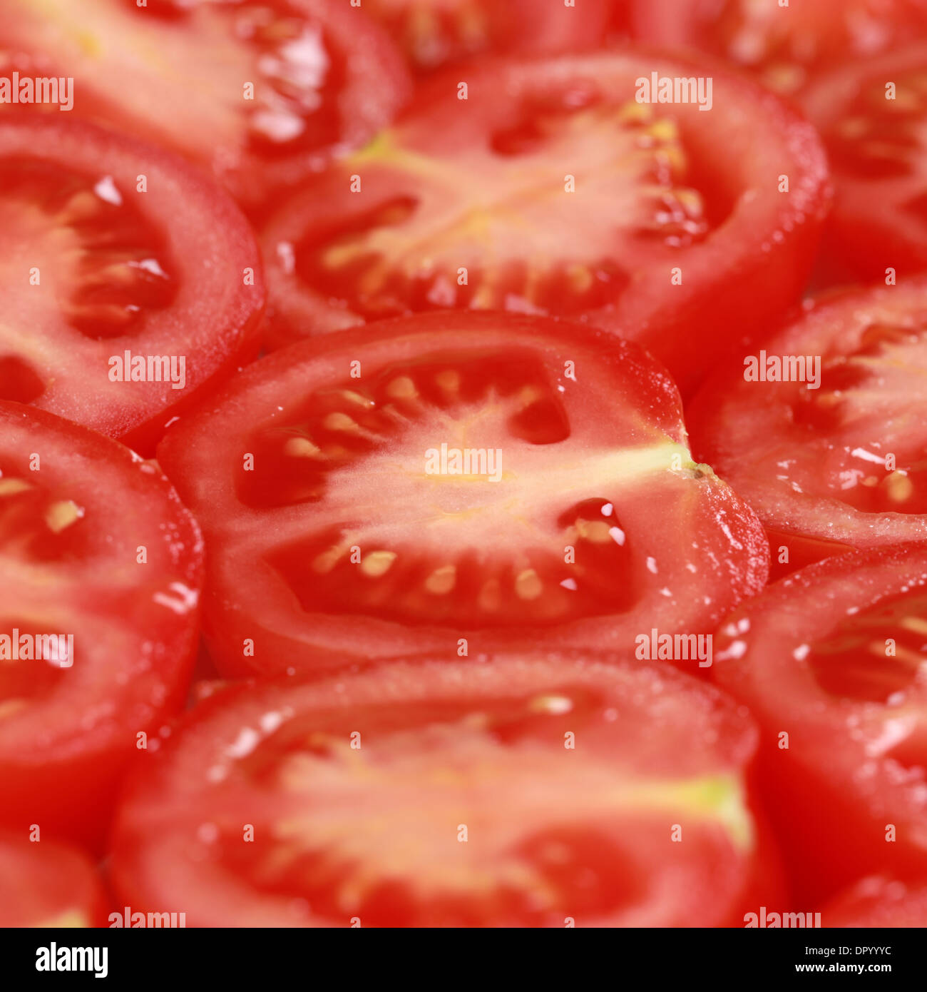 Group of red tomatoes forming a background Stock Photo - Alamy