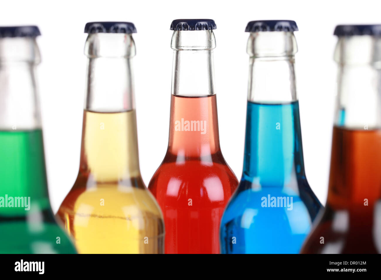 Glass bottles with soft drinks, isolated on a white background Stock