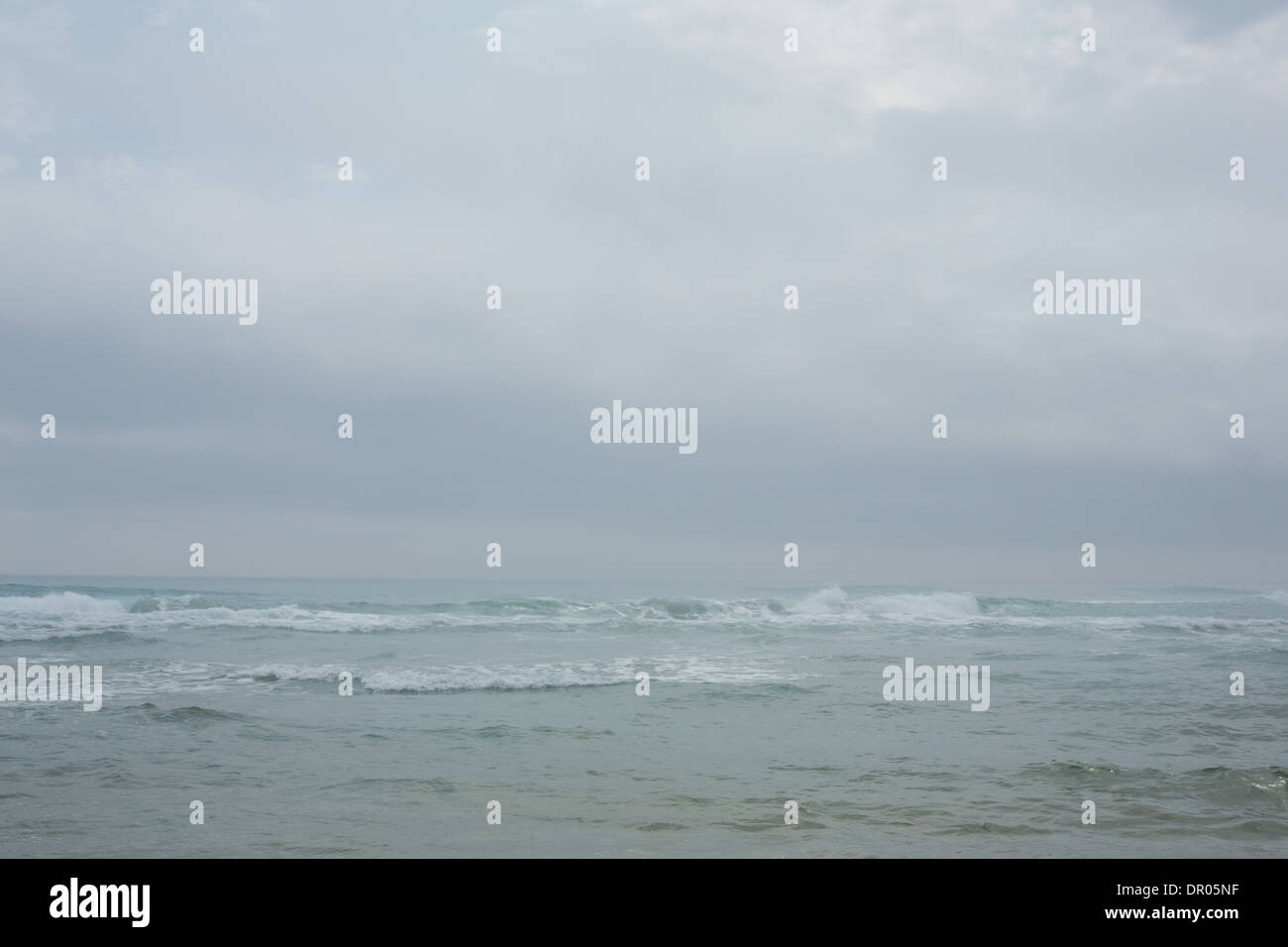 Ocean against the misty sky Stock Photo