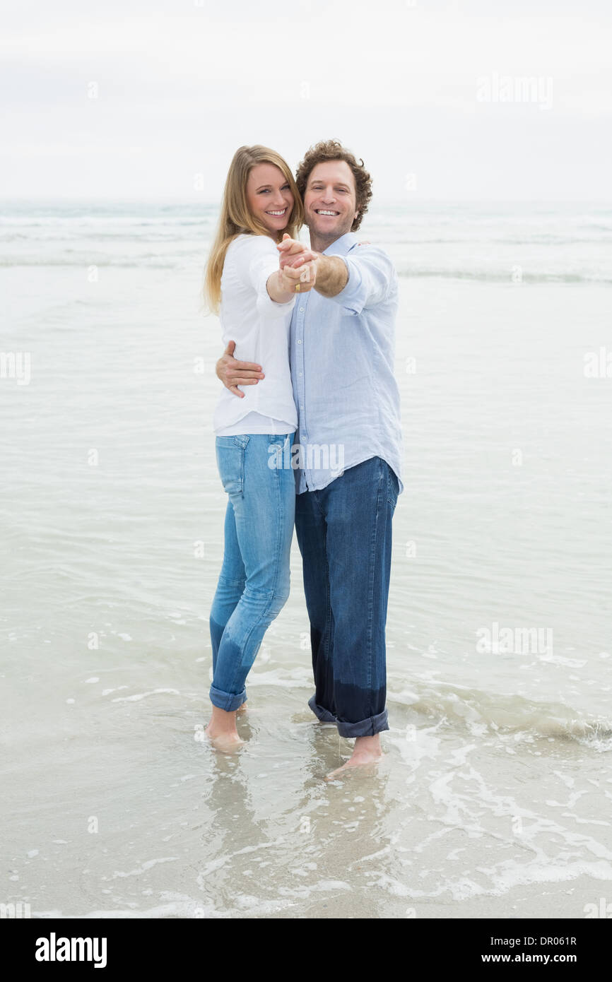 Woman dancing beach jeans hi-res stock photography and images - Alamy