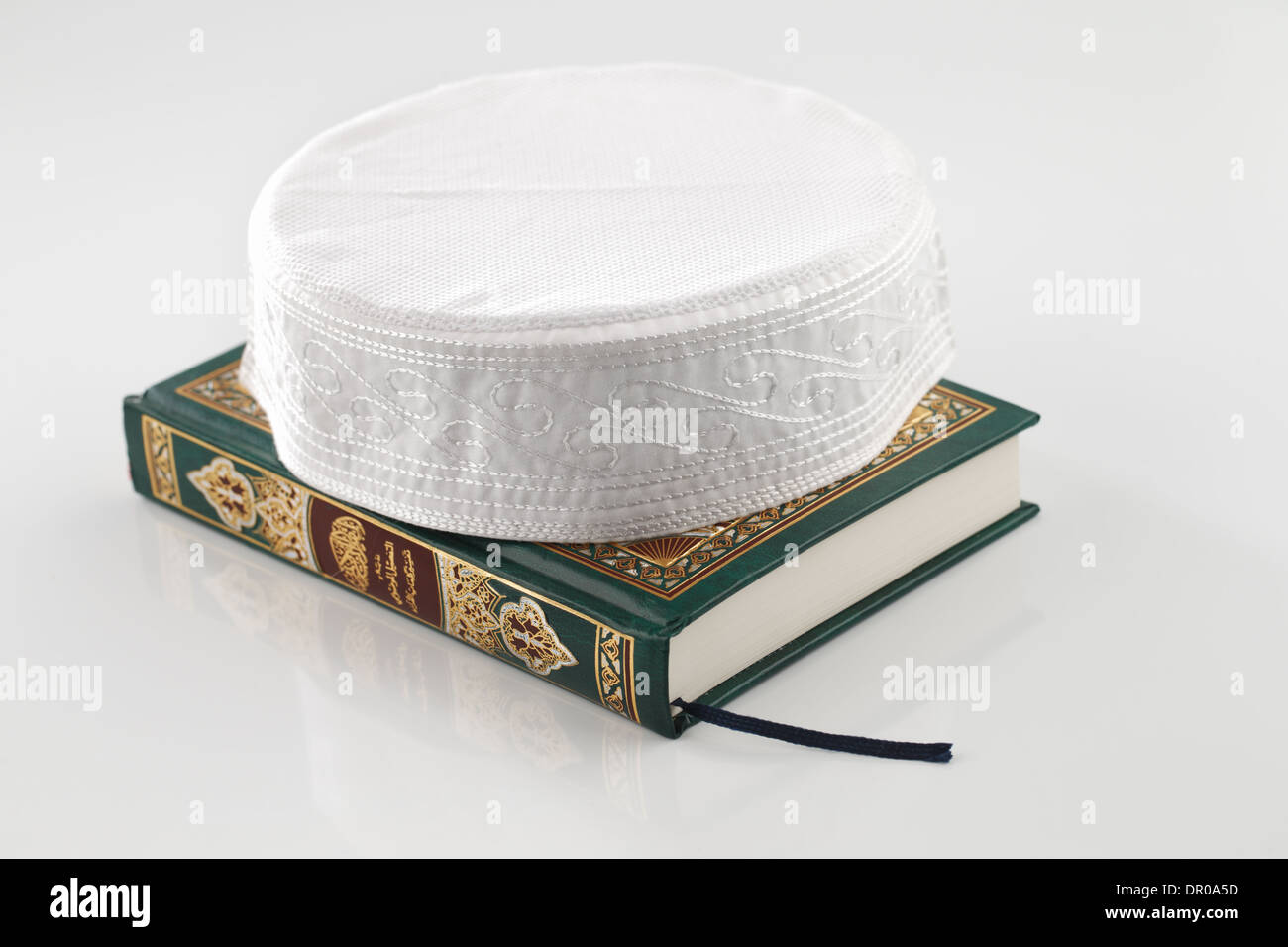 The Quran literally meaning 'the recitation', is the central religious text of Islam Stock Photo
