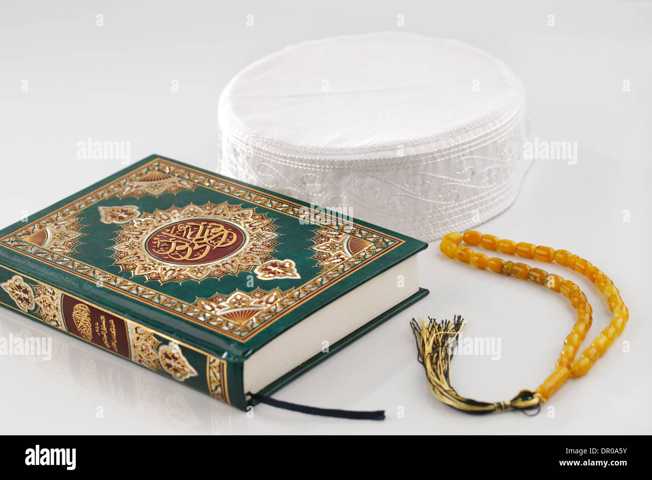 The Quran literally meaning 'the recitation', is the central religious text of Islam Stock Photo