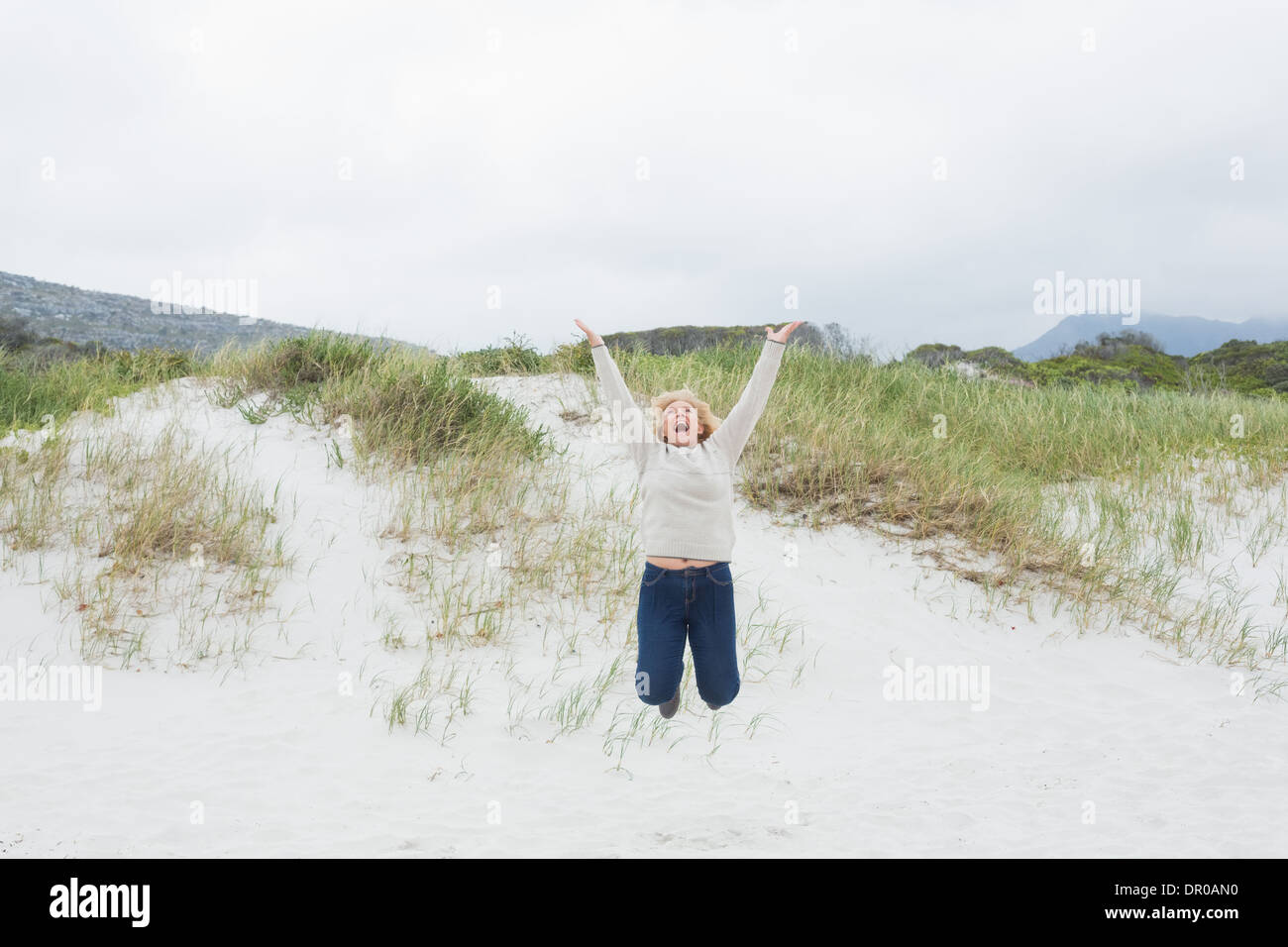 Mature woman beach joy hi-res stock photography and images - Alamy