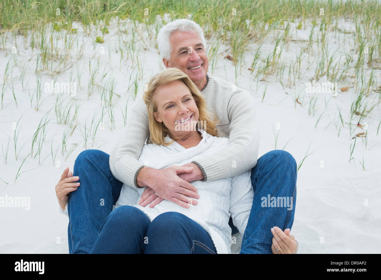 Romantic senior couple relaxing at beach Stock Photo - Alamy