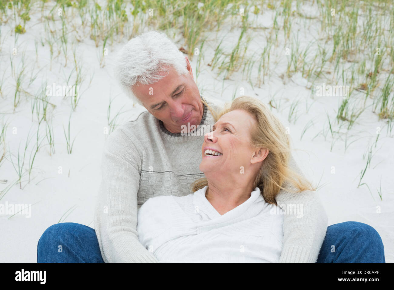 Romantic senior couple relaxing at beach Stock Photo - Alamy