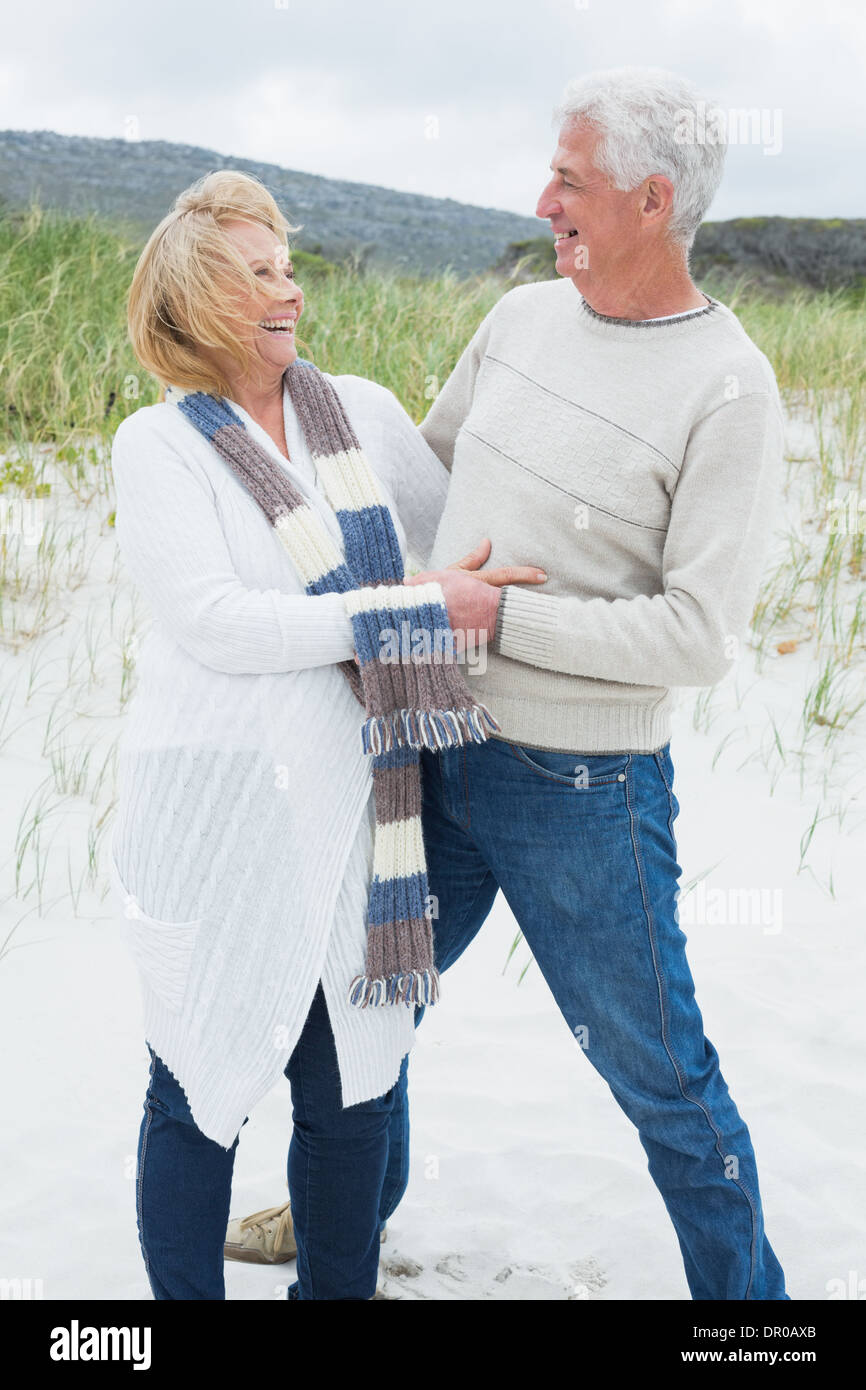 Cheerful romantic senior couple at beach Stock Photo