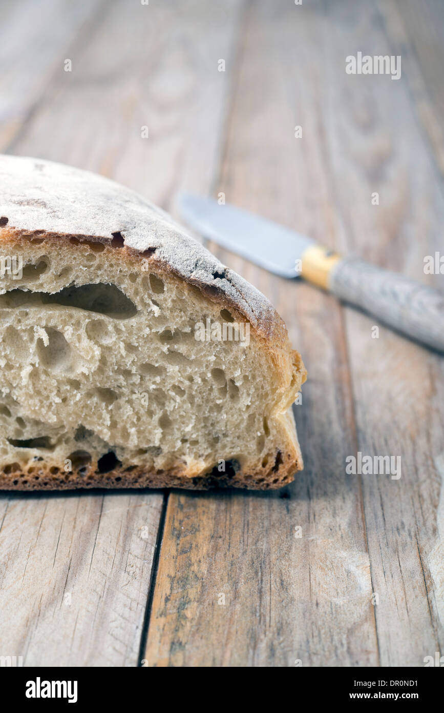 Loaf of bread on a rustic wooden background Stock Photo