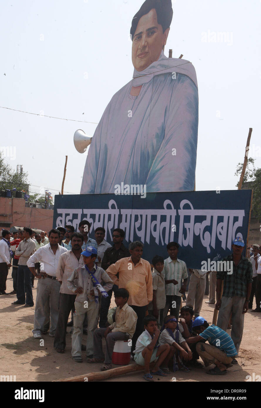 May 04, 2009 - Ghaziabad, India - Supporters of Mayawati, the chief minister of the Indian state Uttar Pradesh and Bahujan Samaj Party (BSP) president, who is shown on the billboard at rear, arrive for a campaign rally. (Credit Image: © Pankaj Nangia/ZUMA Press) Stock Photo