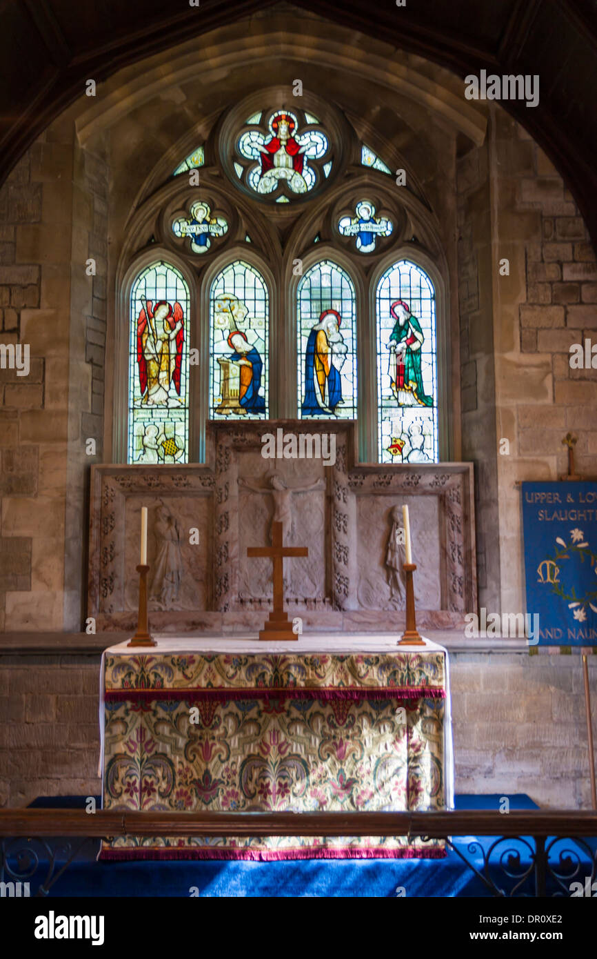 Stained glass church window with alter in front Stock Photo - Alamy