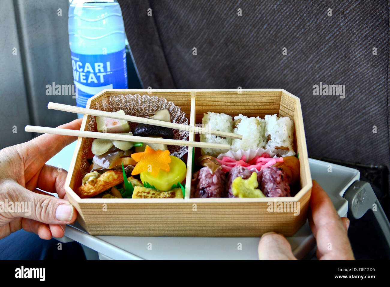 https://c8.alamy.com/comp/DR12D5/a-typical-bento-a-japanese-lunch-box-filled-with-rice-fish-meat-and-DR12D5.jpg