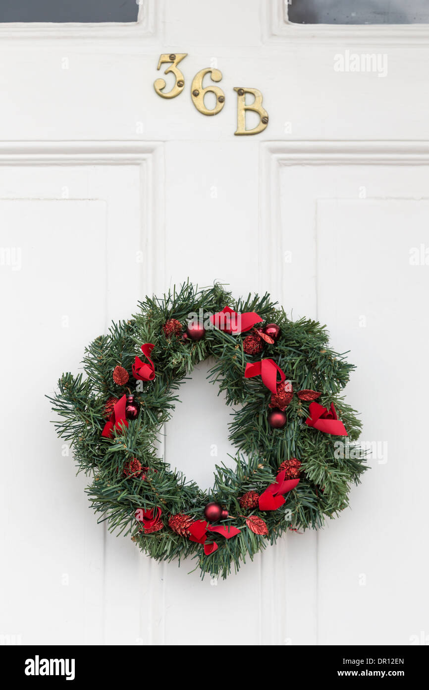 Traditional front door in UK with Christmas reef Stock Photo Alamy