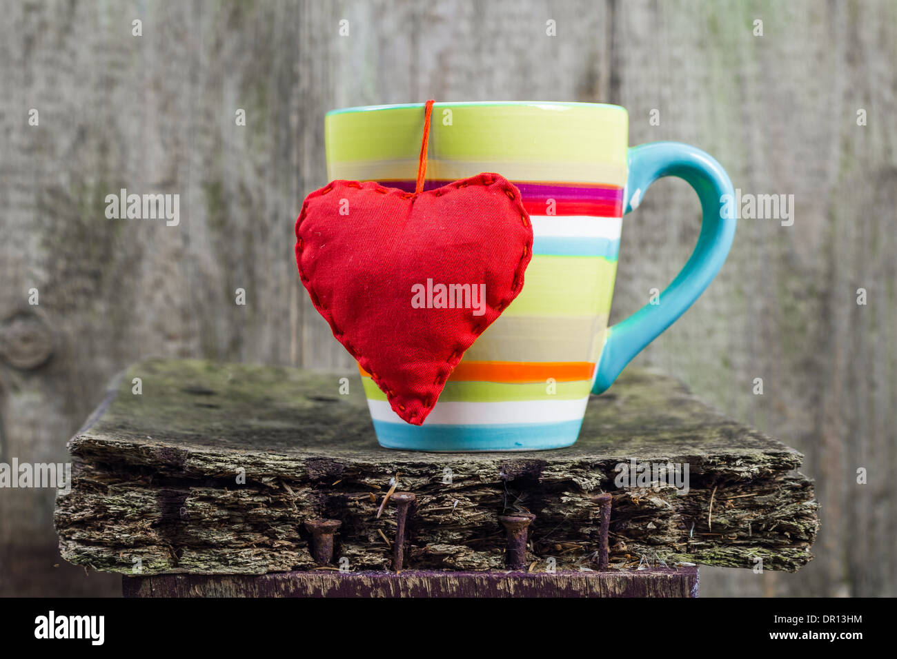 Heart hung on a colored cup Stock Photo