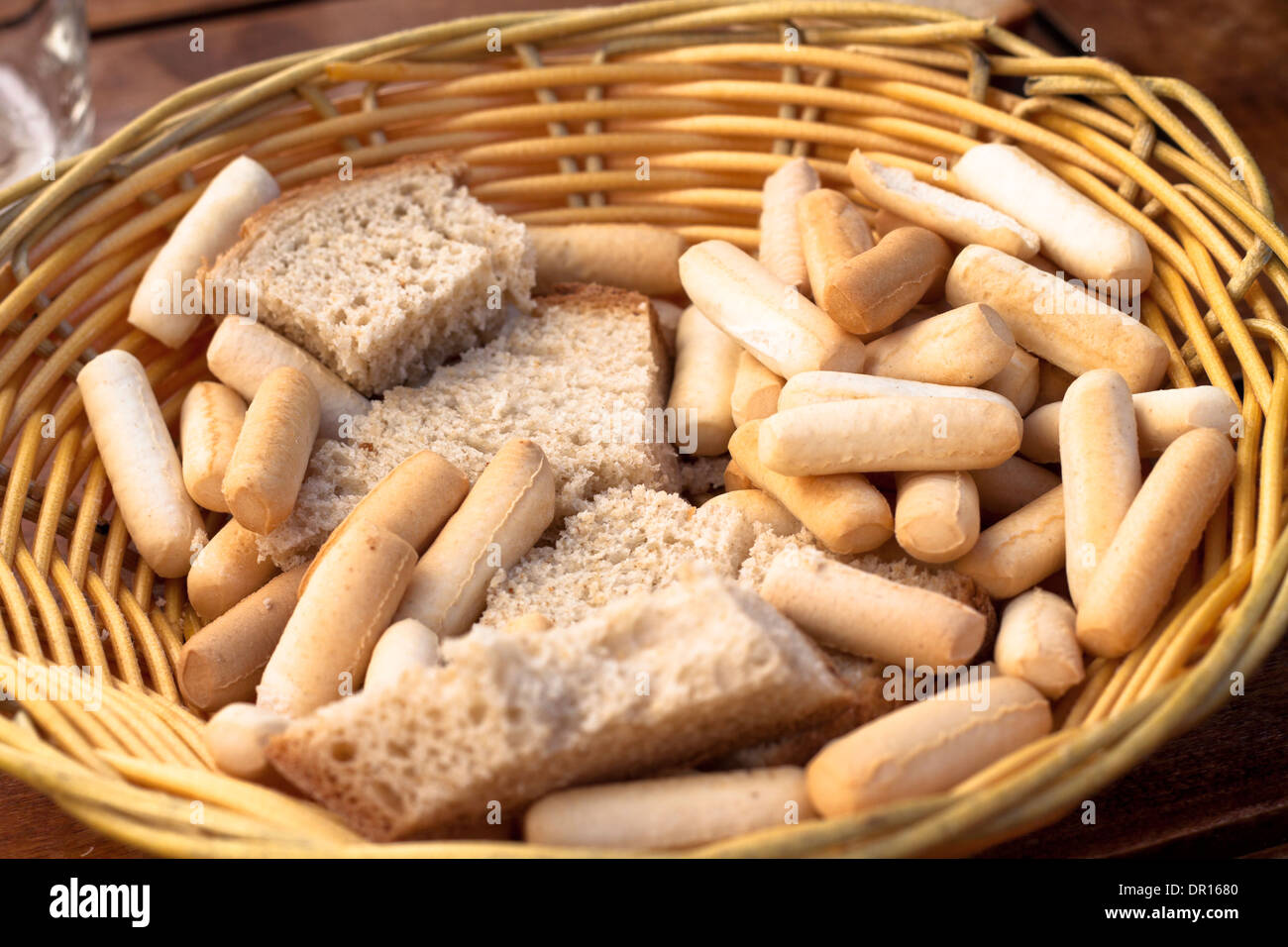 Detail of basket with bread and bread sticks in Spanish Tapas