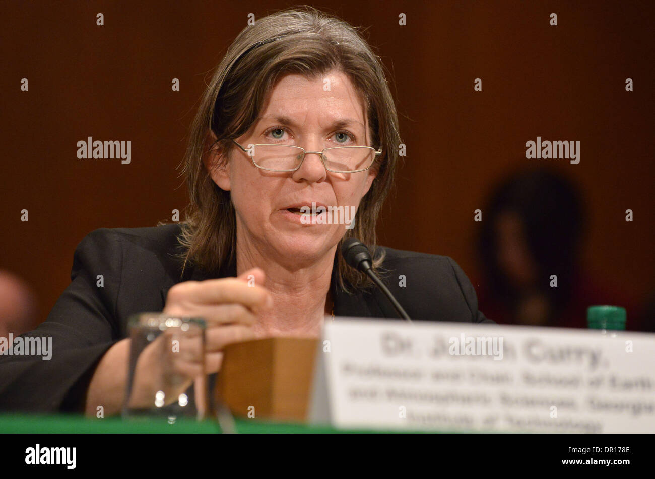 Washington, DC, USA. 16th Jan, 2014. JUDITH CURRY, a climatologist and chair of the School of Earth and Atmospheric Sciences at the Georgia Institute of Technology, answers questions from a skeptical Democratic senator during a contentious Senate Environment and Public Works Committee hearing on climate change. A group of Senate Democrats, including committee chair Sen. Barbara Boxer, D-CA, has launched a new campaign to focus attention on the subject. Credit:  Jay Mallin/ZUMAPRESS.com/Alamy Live News Stock Photo