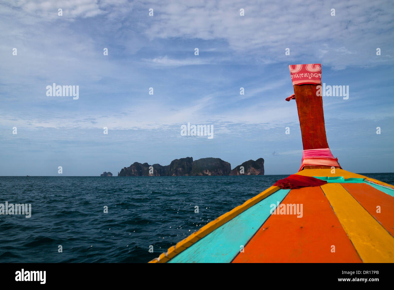 Detail of long tail boat and beautiful scenic coastline of Phi Phi Island in Thailand. Stock Photo
