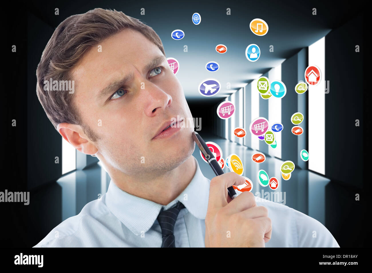Composite image of thinking businessman holding pen Stock Photo - Alamy
