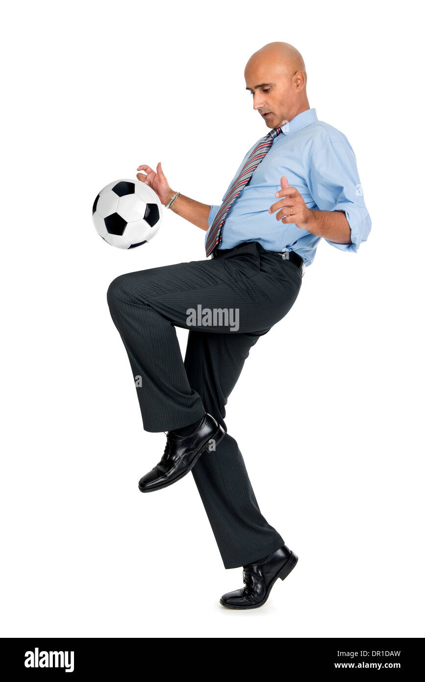 Businessman playing soccer ball isolated in white Stock Photo - Alamy