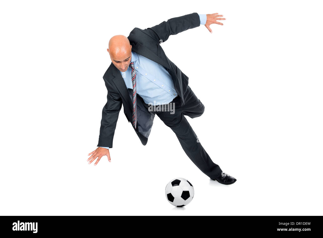 Businessman playing soccer ball isolated in white Stock Photo - Alamy