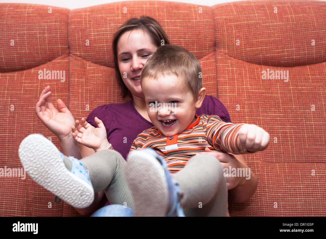 Happy child boy and mother having fun Stock Photo