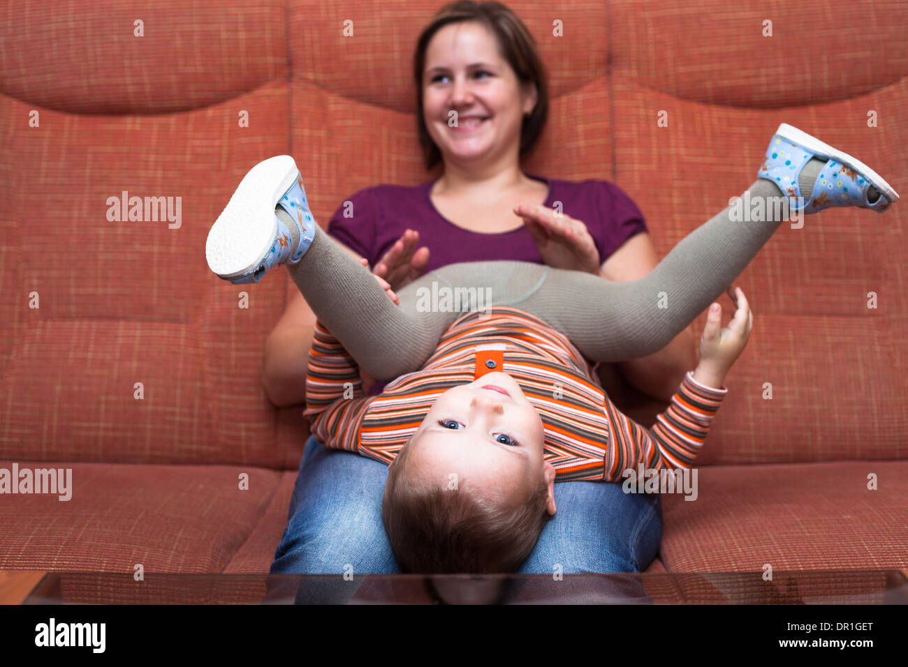 Happy child boy and mother having fun at home Stock Photo