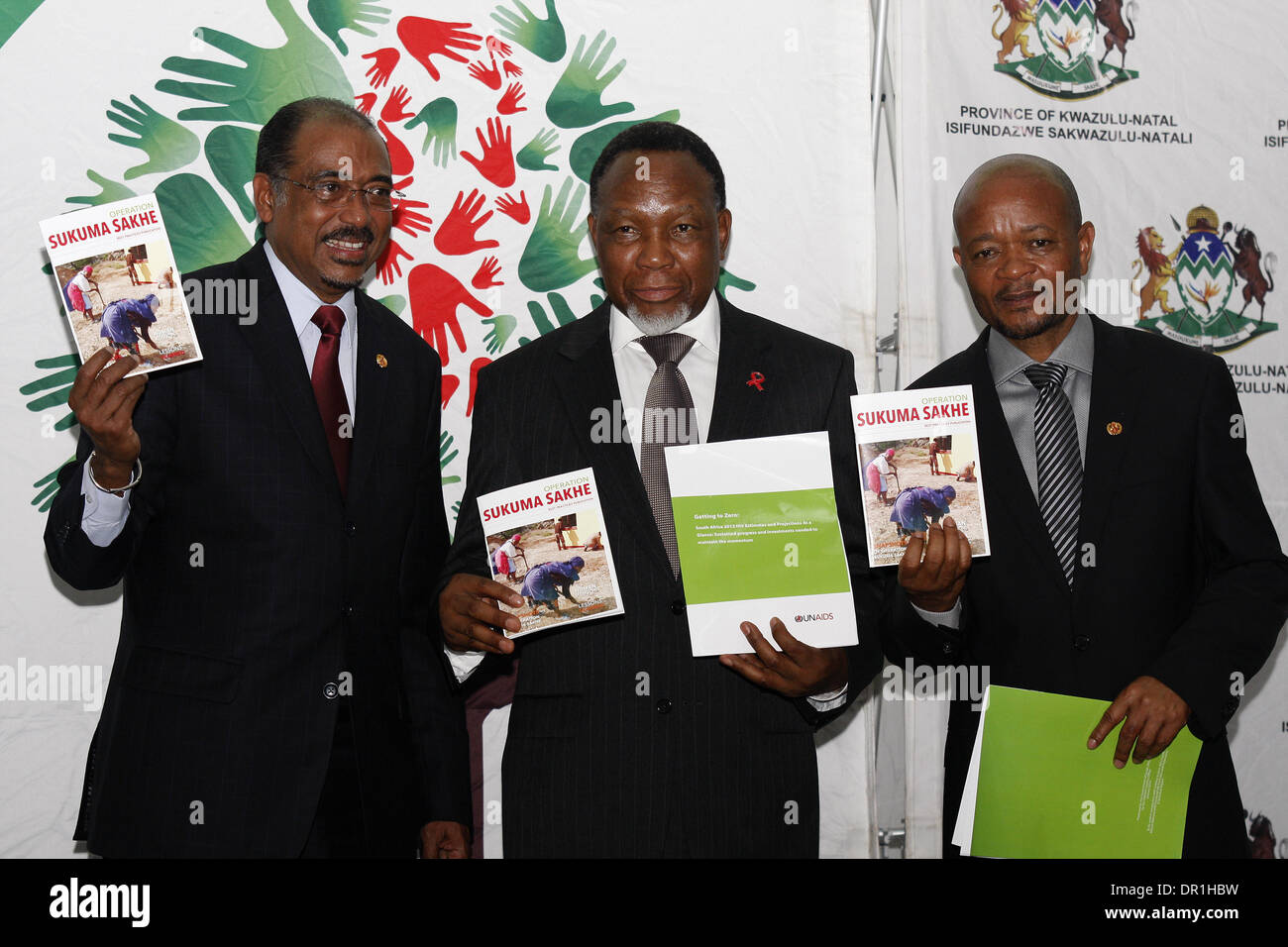 Durban, South Africa. 17th Jan, 2014. UNAIDS executive director Michel Sidibe, South African deputy president Kgalema Motlanthe and KwaZulu-Natal premier Senzo Mchunu hail a report released by the Joint United Nationalk Programme on HIV/AIDS (UNAIDS) shows that the rates of HIV infection as well as deaths from the dreaded disease have fallen in South Africa. Credit:  Giordano Stolley/Alamy Live News Stock Photo