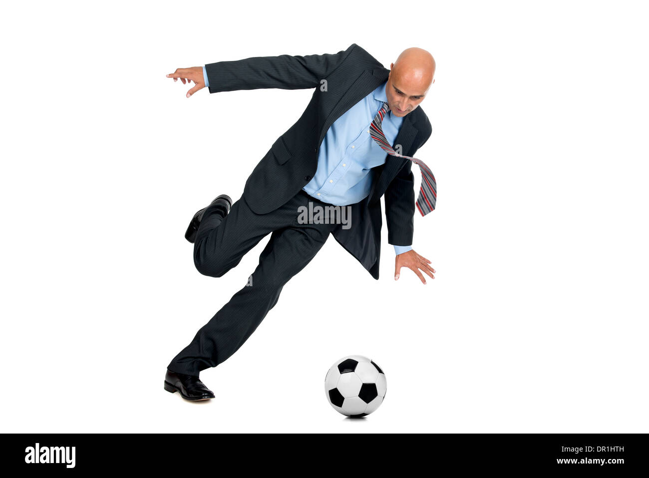 Businessman playing soccer ball isolated in white Stock Photo - Alamy