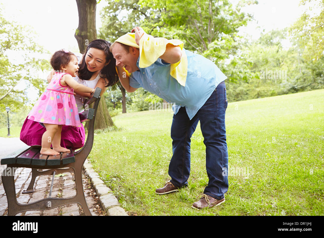 Family playing together in park Stock Photo - Alamy