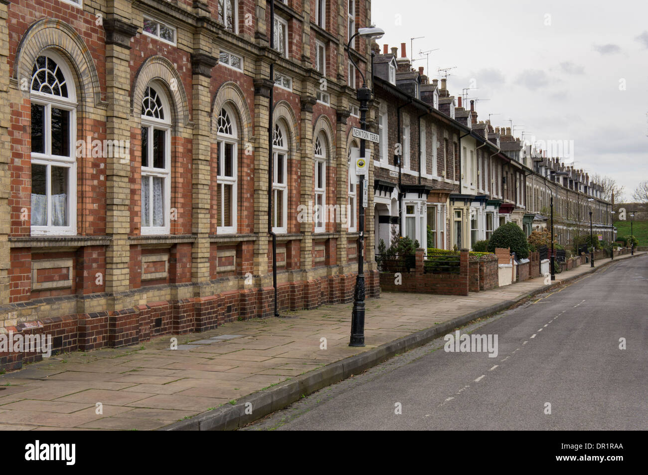 Newton Terrace in residential area of city (uniform row of Victorian terrace houses & historic converted chapel) - York, North Yorkshire, England, UK. Stock Photo