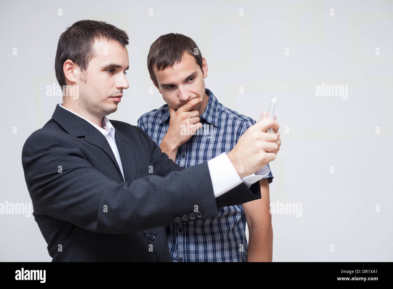 Two businessmen looking at digital tablet. Stock Photo