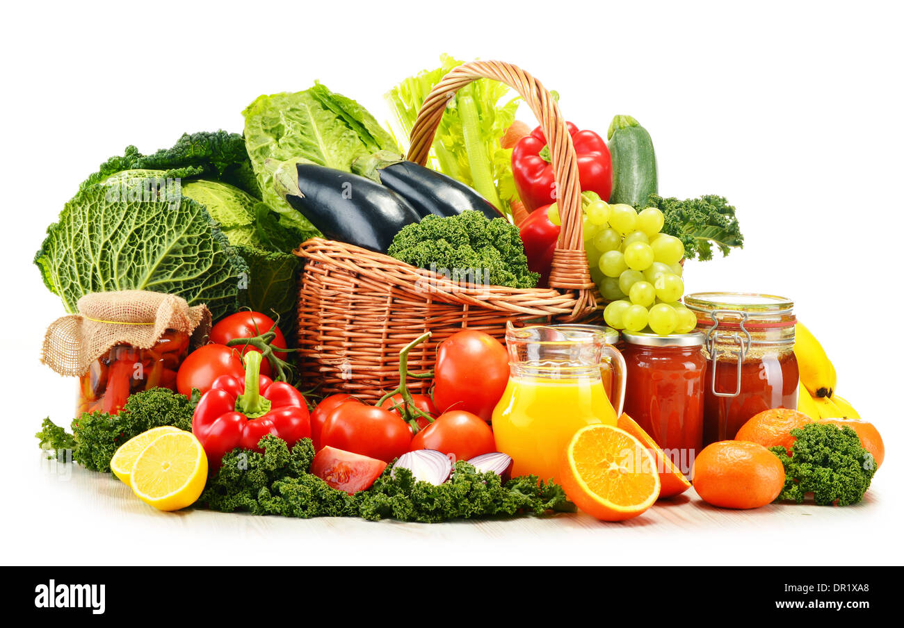 Wicker basket with assorted organic vegetables and fruits isolated on ...