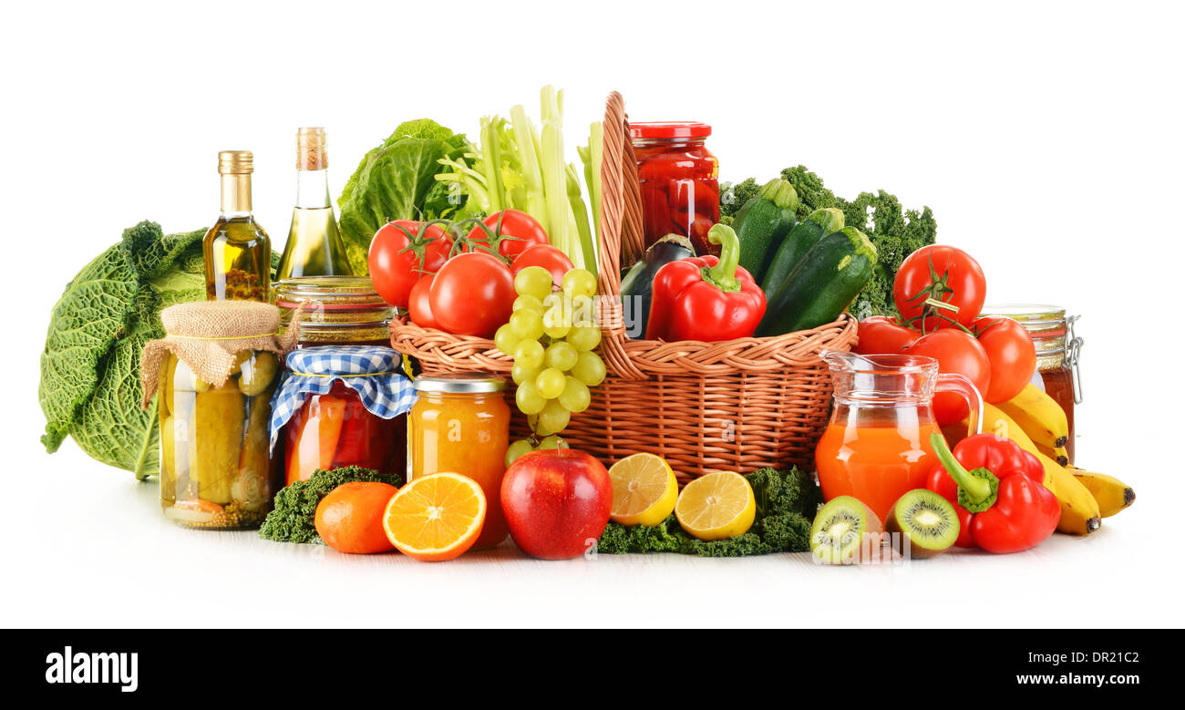 Wicker basket with assorted organic vegetables and fruits isolated on ...