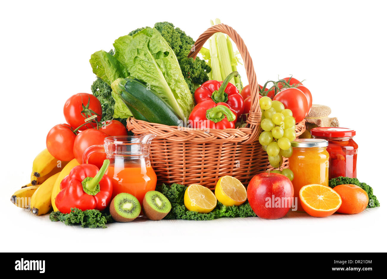 Wicker basket with assorted organic vegetables and fruits isolated on ...