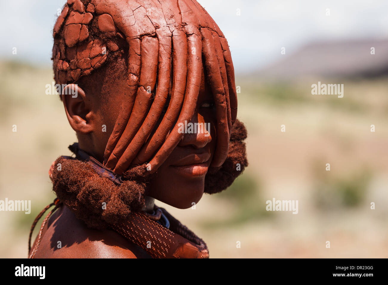 Portrait of Himba woman with traditional mud caked hairstyle covering