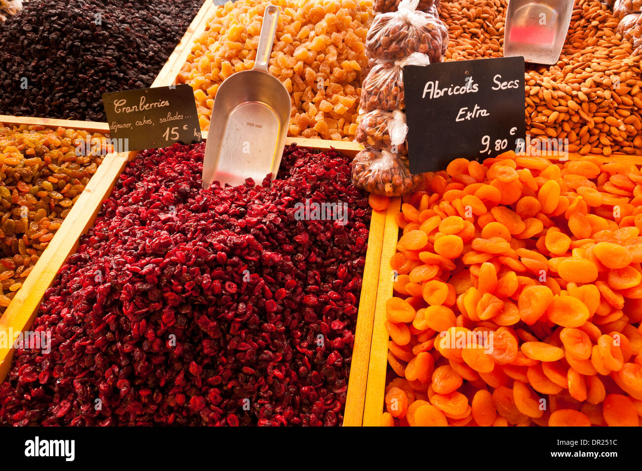 Dried fruit stall at an outdoor market in Mèze, Hérault, Languedoc Roussillon, France Stock Photo